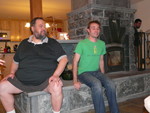 Frank and Matt trying out the masonry heater