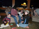 Playing the steal-the-gifts game.  Connor won this box of fantastic chocolates, which Danyel really wanted, but she didn't want to steal it from a child -- until he begged her to, so he could steal his dad's 2 packs of gum and Wendy's gift card!  (Kailyn stole my hiking hat.)