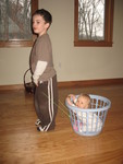 December 18: Connor loves giving Brianna rides in my laundry basket -- and she loves it as much as he does!