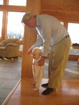 Grandpa Darel helping Brianna walk around