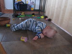 March 23: Some days, having fun is just *too* exhausting! One minute, she was playing with pinecones and playdough toys while I was loading the dishwasher. Next thing I knew, she went all quiet -- and I peeked around the counter to find her asleep!