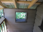 Mini-window off the deck, looking toward the driveway.  I hadn't expected this to be a wall at all, but the little window in it is very cute!