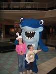 The kids with Sharkey, the aquarium mascot
