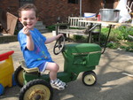Connor riding the toy tractor