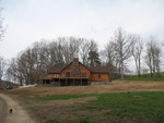 Jimmy's newly-finished house (and their rat terrier in the driveway)
