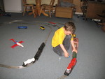 Connor putting little people on the train