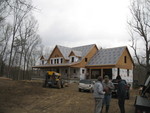 April 14: Visit to the house to go over where electrical switches and outlets go.  Notice all of the roof fabric on now -- it rained while we were there, but we stayed dry!