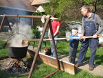 Connor helping Uncle Darel stir the chowder