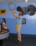 Don catching a bubble on a hoop