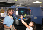 Kailyn putting her hand inside Daddy's giant bubble