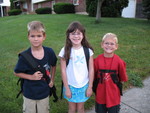 Waiting for the bus with Devon and Trevor, our neighbors from across the street