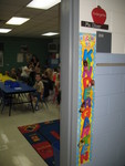 Getting a pic of the cute 'welcome to kindergarten' banner outside the door -- and Connor in the background