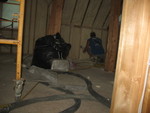 Using a scraping-brush machine to smooth the walls