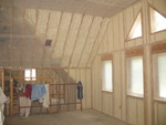 Another pic of insulation in the loft -- here, foam in the joists