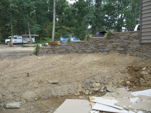 Stonework and grading on west end of the house