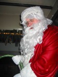 We've reached the North Pole!  Here's Santa, handing out bells