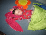 His reaction to me softly calling his name -- throwing his arms up over his head without waking up at all