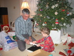 Connor loves his new waffle maker!  (He adores waffles, and I didn't have a waffle iron to make them for him.)  Grandpa helps him examine it