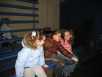 Jenny, Gela, and Laura resting on the bleachers