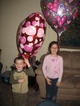 Holding them so that you can actually see the kids!