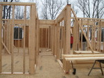 Looking down the hall into the east end of the house.  The nursery is the first room on the left, the master bathroom beyond that, guest bath is straight ahead, and master bedroom is to the right.