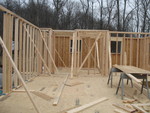 Kitchen with utility room beyond, as seen from the dining room looking north.