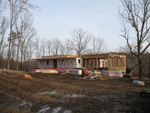 February 28: upstairs floor is on, and the garage is framed and ceilinged