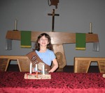 After the ceremony. The pins are to the left of the '85' on her sash