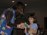 Receiving the badges she earned August-December