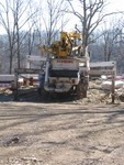 January 9: We finally get a floor! Concrete pumper truck with spider legs to stabilize it