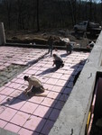 Driving grade stakes. The guys left another job to come over and do ours at the drop of a hat when we found out the concrete could come today, so the concrete could start curing before the weather gets bad again.