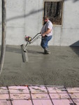 This device vibrates the concrete to make it settle faster and get the surface ready for further smoothing