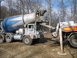 Concrete truck feeding the boom truck