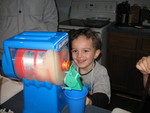January 12: Connor bought a slurpee-maker with part of his Christmas money.  Making his first slurpee (with white grape juice)