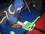 January 13: One more great use for the OLPC -- entertaining Connor during his sister's school awards ceremony!