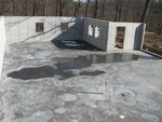 No framing yet, but neat water ring patterns on the concrete. (Don tells me we actually need to seal the concrete prior to framing, so that's the next step, THEN framing.)