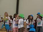 The little girl next to Connor putting her hat on him after the last song