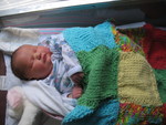 With the blanket Amy made for her