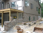 Most of the eastern wall is done now -- just a bit to go on the retaining wall part, and then the cistern end