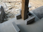 Laying out blocks to see how the stone base to the porch post might go