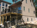 East end of the house now, with stonework and deck rails complete