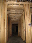 Wall to wall soffit = dropped ceiling in wine closet and hallway. Ceiling is still about 8 feet above the floor.
