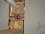 PVC coupling added where Bobby had inadvertently sliced through the PEX in the wall