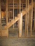 Small door into the storage space under the stairs