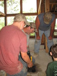Yet more attempts to remove the wood from the chimney flue -- but they're finally making good progress. This time they had a 2-inch bit that was chopping through the wood like crazy.