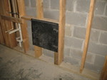 Ash dump door at the bottom of the masonry heater