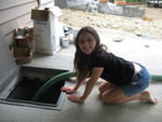 Kailyn watching water being pumped into the cistern