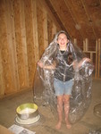 Kailyn wearing a plastic bag so she could handle insulation to help the insulation guys.