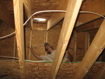 Working on the hole for the sun tube in the play room.