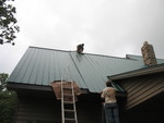 Placing the sun tube parts underneath the roof metal